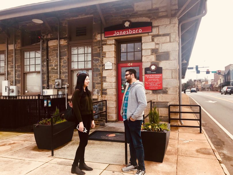 History buffs and Gone with the Wind enthusiasts, Viranch Trivedi and Hui Wang, standing in front of The Road to Tara Museum